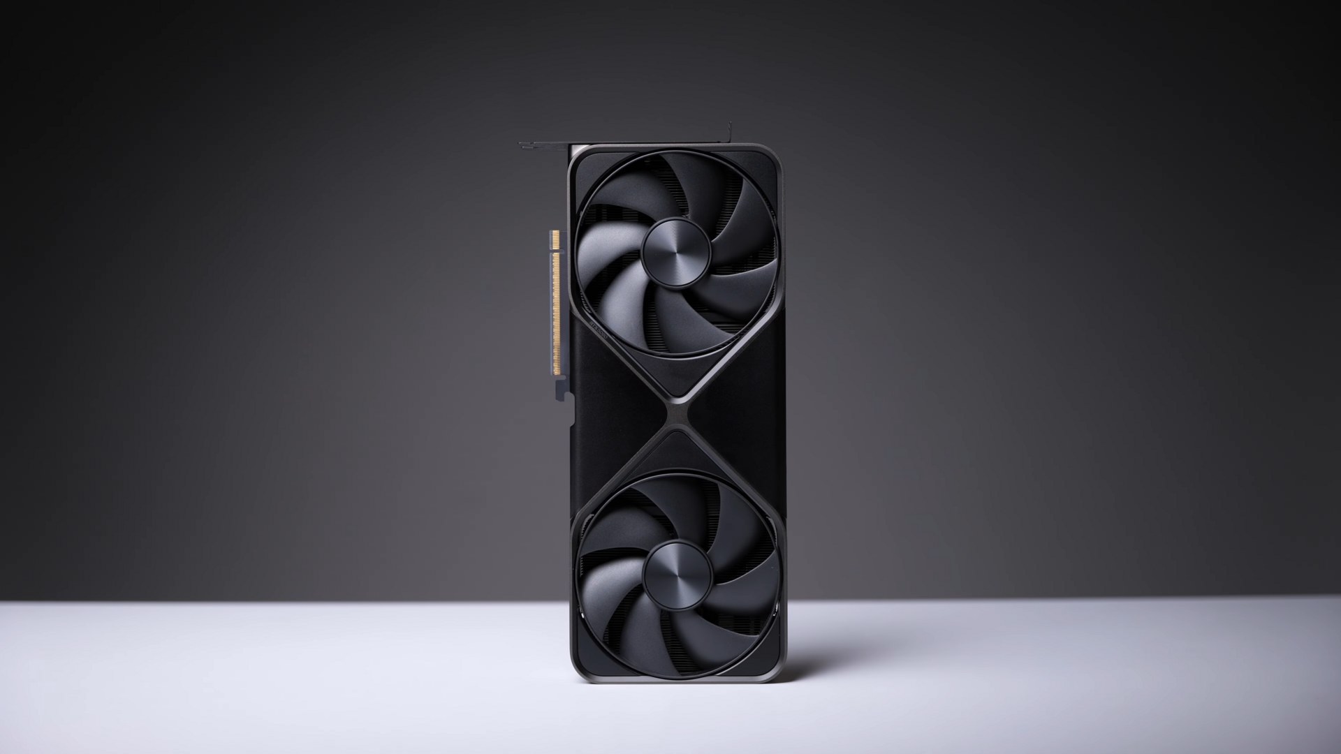 Nvidia RTX 5090 顯卡旁邊嘅顯示器，上面播放實時生成嘅遊戲畫面